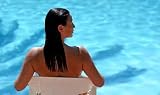 Attractive Woman Sitting by Blue Sunny Swimming Pool - 18W x 11H - Peel and Stick Wall Decal by Wallmonkeys
