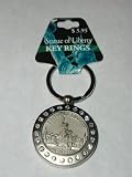 STATUE OF LIBERTY KEY RING. FEATURES A KEYRING WITH A MATTE SILVER DISK. IT MEASURES 1-11/16TH INCHES. THE BACK OF THE DISK IS PLAIN. THE FRONT FEATURES THE STATUE OF LIBERTY IN FRONT OF NEW YORK SCENE. THERE ARE RHINESTONES ALL AROUND THE FRONT DISK. THE DISK SEPERATES (MAGNETS HOLD IT TOGETHER) TO REVEAL A MAKE-UP MIRROR ON ONE SIDE AND A PHOTO FRAME ON THE OTHER. THE KEY RING IS 1-6/16THS INCHES. KEY CHAIN KEYCHAIN.
