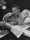 Teen Age Boy Drinking Coke and Eating Crackers in Bed Photographic Poster Print by Nina Leen, 12x16