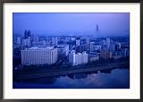 City Skyline from 17 Yanggakdo Hotel, P'Yongyang, North Korea Framed Photographic Poster Print by Tony Wheeler, 35x25