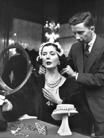 Salesman at Cartier's Showing a Diamond Necklace to Mrs. Julien Chaqueneau of New York Society Stretched Canvas Poster Print by Alfred Eisenstaedt, 12x16
