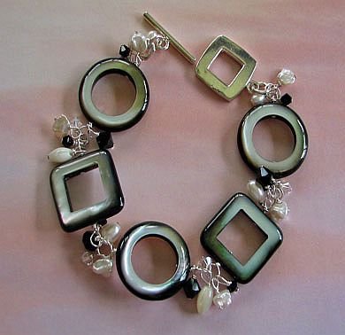Click here to buy Black Mother of Pearl, Freshwater Pearl & Swarovski Bracelet.