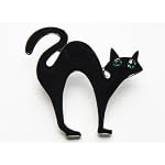 black cat pin with emerald crystal eyes