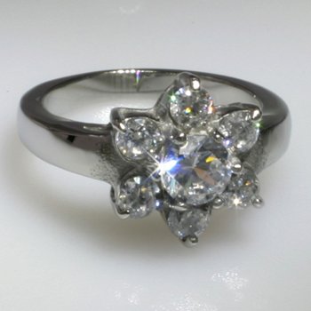 Click here to buy 316L Stainless Steel Ring with 7 hand set cubic zirconia stones by ToltecTraders.com.