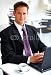 Wallmonkeys Peel and Stick Wall Decals - Businessman at an Airport Restaurent - Removable Graphic