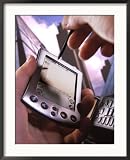 Hand Holding Palm Pilot M500 with Cell Phone Framed Photographic Poster Print by Eric Kamp, 28x34