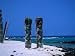 Two Tall Wooden Ki'I Stand Guard Near Hale O Kaewe Heiau at Pu'Uhonua O Honaunau Photographic Poster Print by Ann Cecil, 16x12