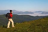 Girl with Black Backpack Walking on the Meadow - 24