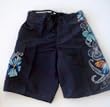 Mens Swim Trunks with Drawstring Waist, Half Elastic Back, Side Flap Pocket with Velcro Closing. Mesh Lined. Velcro Fly Front and Board Short Style Closure. Black Stripe/Floral in Sizes S-XXL.