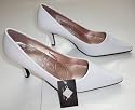 Womens' white slip on pointed toe kitten heel shoes. UK