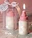 Pink baby bottle candle