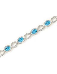 14kt Yellow Gold Oval Blue Topaz Bracelet.