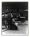 Historic Print (L): Minnie Paster, 10 years old. Tending stand at Bowery & Bond. Location: New York, New Yor