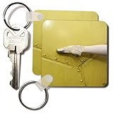 IMAGE OF Ballerina shoe contrasting with a metal yellow background - Set Of 2 Key Chains