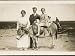 Decorous Little Girl on a Donkey Poses to be Photographed with Her Parents Photograph...