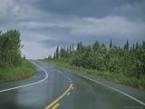 The Alaskan Highway Glistens from Rainfall Near Anchorage, Alaska Photographic Poster Print by Stacy Gold, 32x24