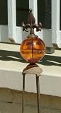 Rustic Iron Fleur de Lis Obelisk with Amber Suncatcher Glass Gazing Globe