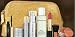 Elizabeth Arden NEW! Winter Holidays 2011 9-piece Beauty Skin Care Gift Set: PREVAGE Face Advanced Anti-aging Serum + PREVAGE Day Intensive Anti-aging Moisture Cream SPF 30 + PREVAGE Night Anti-aging Restorative Cream + All Gone Eye and Lip Makeup Remover + Ceramide Ultra Lipstick in Coral + Pure Finish Mineral Bronzing Powder + Kabuki brush + Ceramide Lash Extending Treatment Mascara in black + Gold Cosmetics Bag