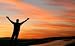Man with Outstretched Arms Facing a Beautiful Sunset. - 24