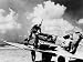 Allies in the Libyan Desert. Feeding Bullets into a Curtiss P40F Warhawk, 1942 Photog...