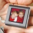 BROOKSTONE PICTURE BOOK MINI DIGITAL PHOTO KEY CHAIN - HOLDS 56 COLOR PHOTOS, BUILT IN 8 MB OF MEMORY, AUTO RESIZE PHOTOS TO FIT SCREEN, HIGH RESOLUTION 1.4" LCD COLOR SCREEN,RECHARGABLE BATTERY 2.5 HOURS OF VIEWING TIME,FAST EASY DOWNLOADS FROM PC,OR MAC, WITH INCL.SOFTWARE, CONNECTS TO COMPUTER WITH USB CORD