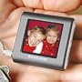 BROOKSTONE PICTURE BOOK MINI DIGITAL PHOTO KEY CHAIN - HOLDS 56 COLOR PHOTOS, BUILT IN 8 MB OF MEMORY, AUTO RESIZE PHOTOS TO FIT SCREEN, HIGH RESOLUTION 1.4" LCD COLOR SCREEN,RECHARGABLE BATTERY 2.5 HOURS OF VIEWING TIME,FAST EASY DOWNLOADS FROM PC,OR MAC, WITH INCL.SOFTWARE, CONNECTS TO COMPUTER WITH USB CORD