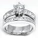 Solid Sterling Silver Cubic Zirconia Rhodium Plated 2 Piece Wedding Ring with Round Center Stone & Princess Cut Channel Set Cubic Zirconia Stones Please specify size: 5