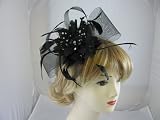 Elegant Black net bow and flower with a touch of Silver Fascinator on Comb .Brand new Item .Ideal For Wedding,Ladies day,Race meetings ,Ascot ,Special occasion..