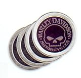 Harley-Davidson® Skull Coaster Set. Set of four coasters. Molded galvanized metal with absorbent foam center. Printed graphics. Measures 4 in diameter. 99356-09V