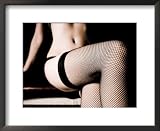 WOMAN SITTING ON EDGE OF BED AND WEARING LINGERIE WITH FISHNET STOCKINGS COLLECTIONS FRAMED PHOTOGRAPHIC POSTER PRINT, 22×18