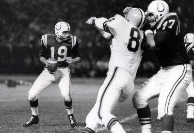 Professionally Framed Johnny Unitas with Football Archival Photo Sports Poster Print - 11x17 with RichAndFramous Black Wood Frame