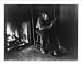 Historic Print (L): [Adirondack Mountains, N.Y.: Absorbed - man reading by fireplace]