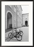 Bicycles in the Domplatz, Salzburg, Austria Framed Photographic Poster Print by Walter Bibikow, 21x29