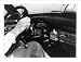 Historic Print (L): [Steering wheel and dashboard of 1953 Cadillac, with pack of cigarettes and parking mete