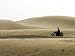 Man Riding Through Karakum Desert on Motorcycle Art Photographic Poster Print by Christopher Herwig, 16x12
