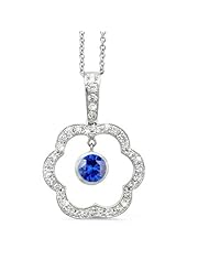 Open Carnation Floral Diamond Pendant With A Round Center Stone In 18K White Gold With A 0.65 ct. Genuine Blue Sapphire Center Stone.