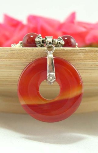 Click here to buy Burgandy Jade Pendant on a Velvet Choker Necklace Pendant.