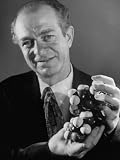Dr. Linus Pauling Holding a Wooden Model of the Molecular Structure of Protein Premium Photographic Poster Print by Ralph Morse, 30x40