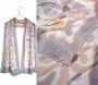ULRIKE Oblong Chiffon Silk Scarf - The border, a glaze of lavender gray over a peach still discrnable below it and bleeding out full strength at the edge, surrounds a field of ivory and a daubed floral mosaic in lavender, mocha, and antique rose.