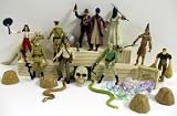 Indiana Jones 36 Piece Play Set Featuring 10 Random Indiana Jones Action Figures, Skull, Jewels and Treasures, Snakes, Dinosaur Skeleton, Top Secret Box, Boulder, and 12 Guns, Knives, and AccessoriesIMAGE