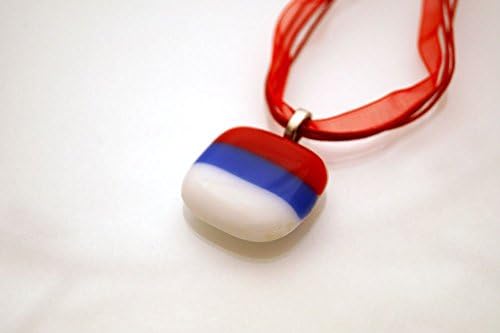 Red, blue and white glass pendant on a ribbon chokker.
