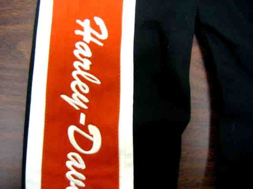 Harley Davidson Womens Prestige Cotton JacketNEW FOR 2008100% Cotton, water-resistant coating. Zipper front. Snap-down collar. Polly-twill lining. Action back. Snap cuffs. Two hand-warmer pockets and one inside pocket. Custom hardware. Colorblock design with twill appliqués and embroideries on front, back, and sleeves, 98413-08VW
