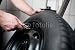 Wallmonkeys Peel and Stick Wall Decals - Mechanic Filling Air into a Car Tyre. - Removable Graphic