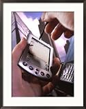 Hand Holding Palm Pilot M500 with Cell Phone Framed Art Poster Print by Eric Kamp, 22x26