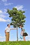 IMAGE OF Wallmonkeys Peel and Stick Wall Decals - Father and Daughter Watering a Young Tree - 60