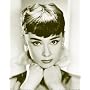 Audrey Hepburn (Head on Hands, B&W) Movie Poster Print - 16" x 20"