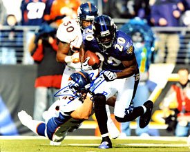 Ed Reed Autographed / Signed Breaking a Tackle 8x10 Photo