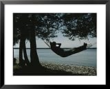 A Person Relaxes in a Hammock That Overlooks Lake Michigan Photography Framed Art Poster Print, 31x25