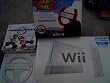 Nintendo Wii Console System with Wii Sports/Mart Kart Video game with 2 Wheels/Plus Extra Red/Blue Dreamgear Wheel