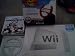 Nintendo Wii Console System with Wii Sports/Mart Kart Video game with 2 Wheels/Plus Extra Red/Blue Dreamgear Wheel